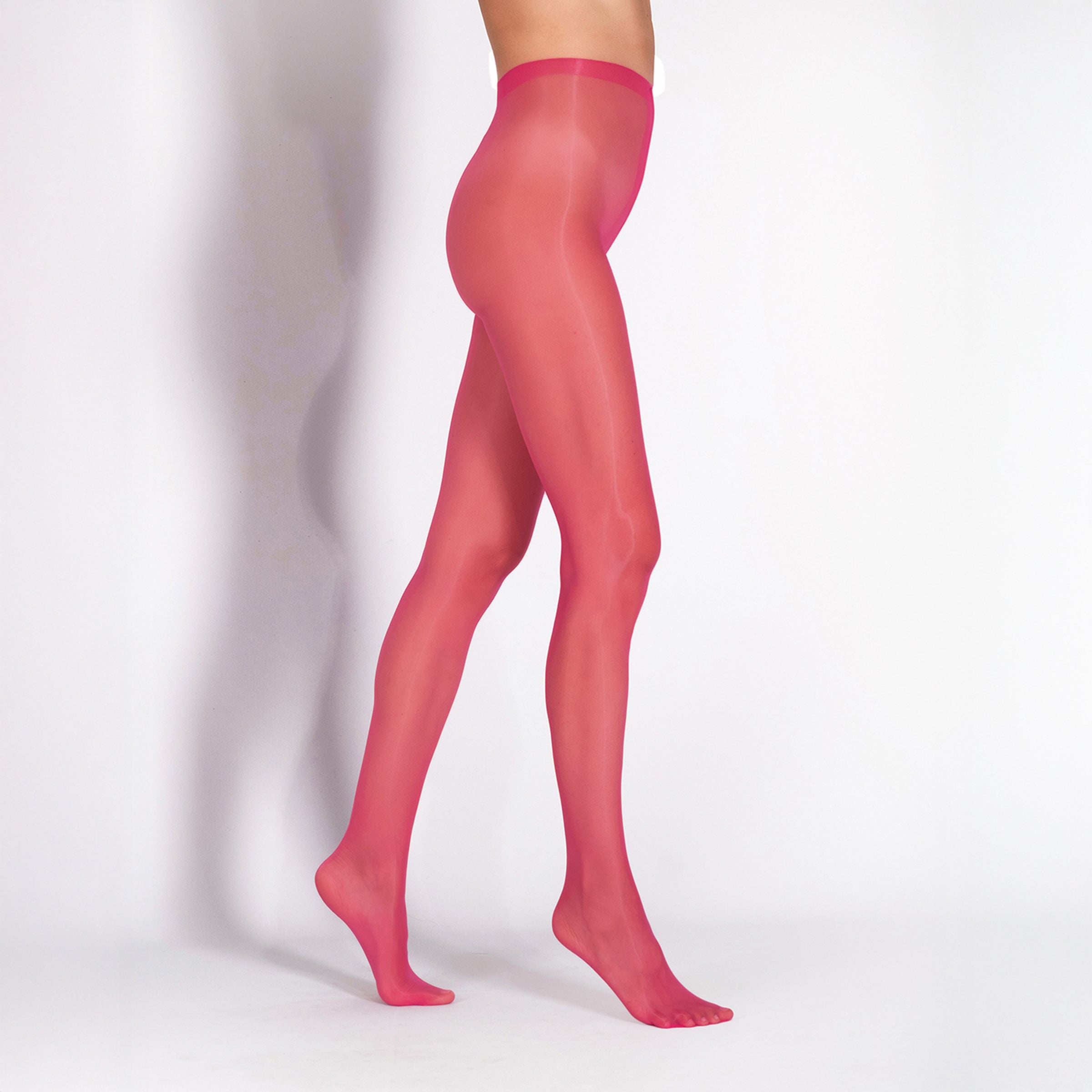 Pink tights worn by a person on a white background