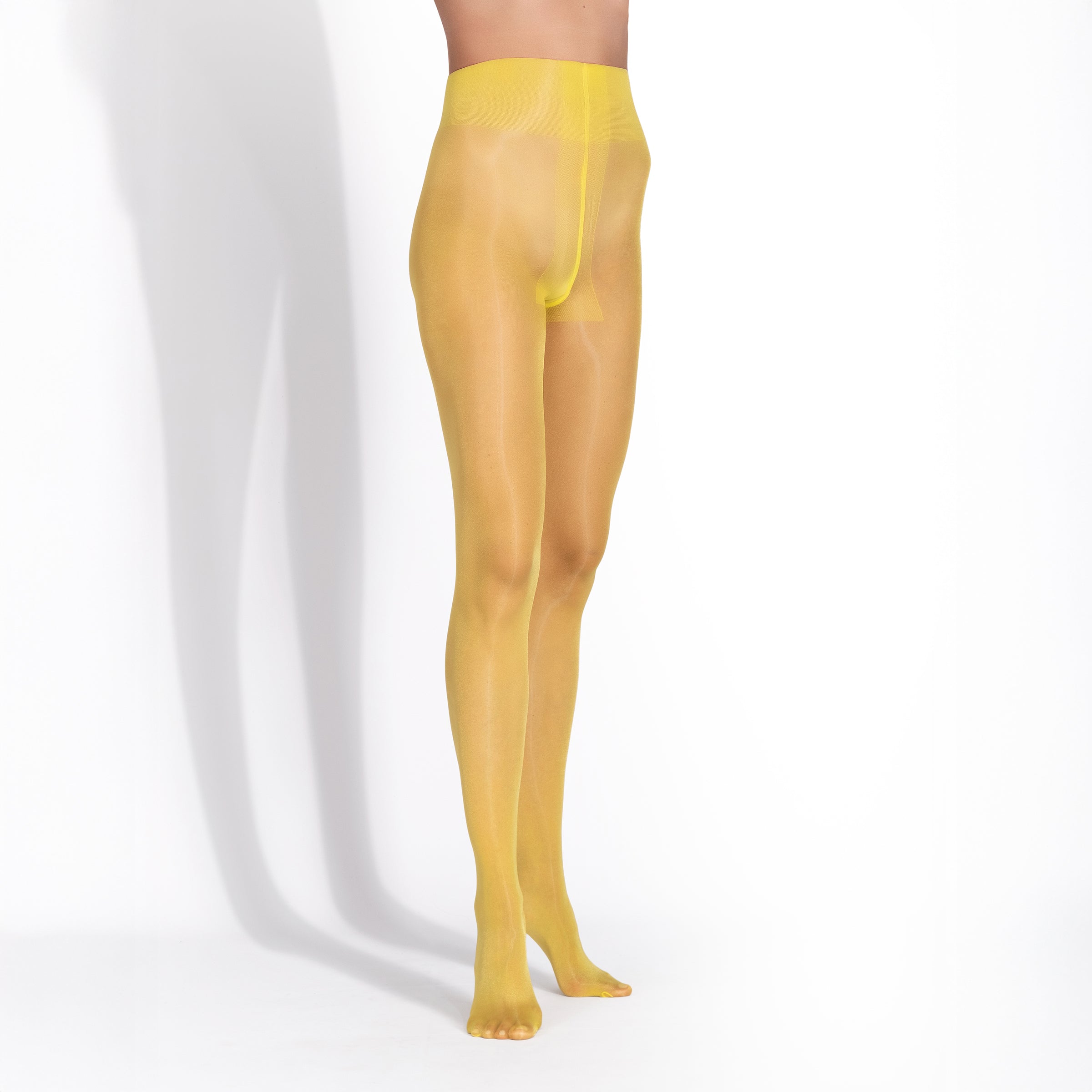 Yellow sheer thigh-high stockings on a white background