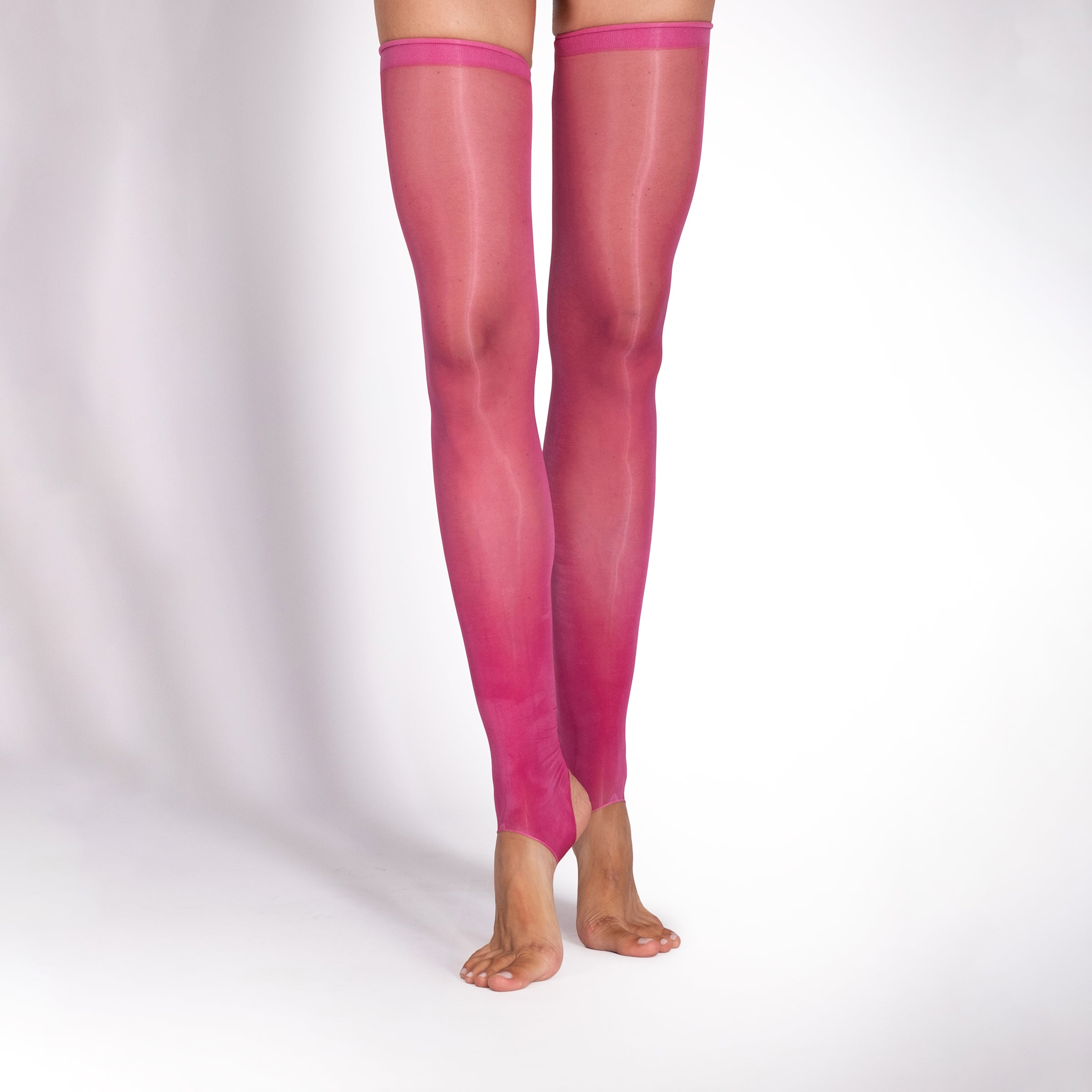 Pink sheer thigh-high stockings on a white background