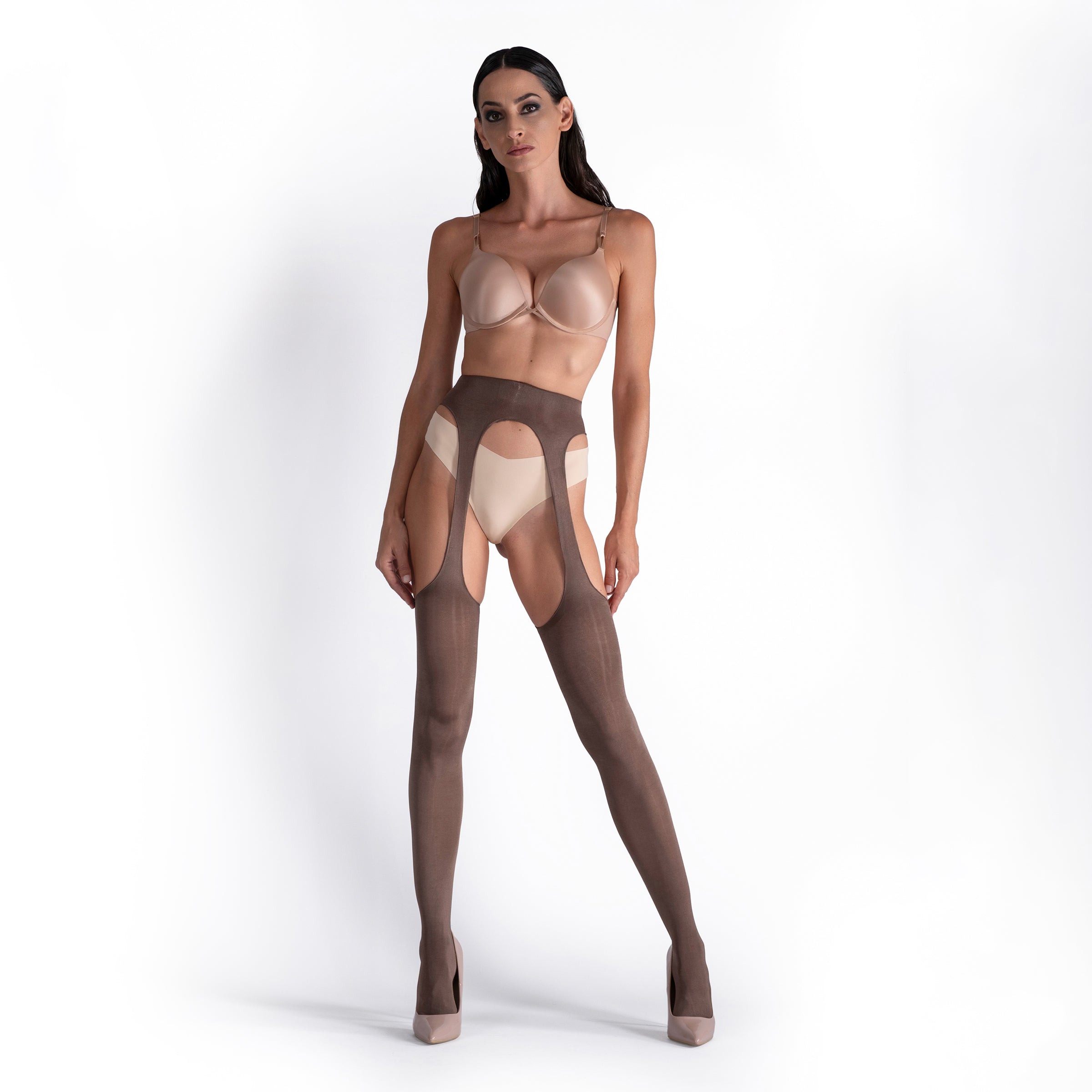 Woman wearing a sheer bodysuit with cut-out design on a white background